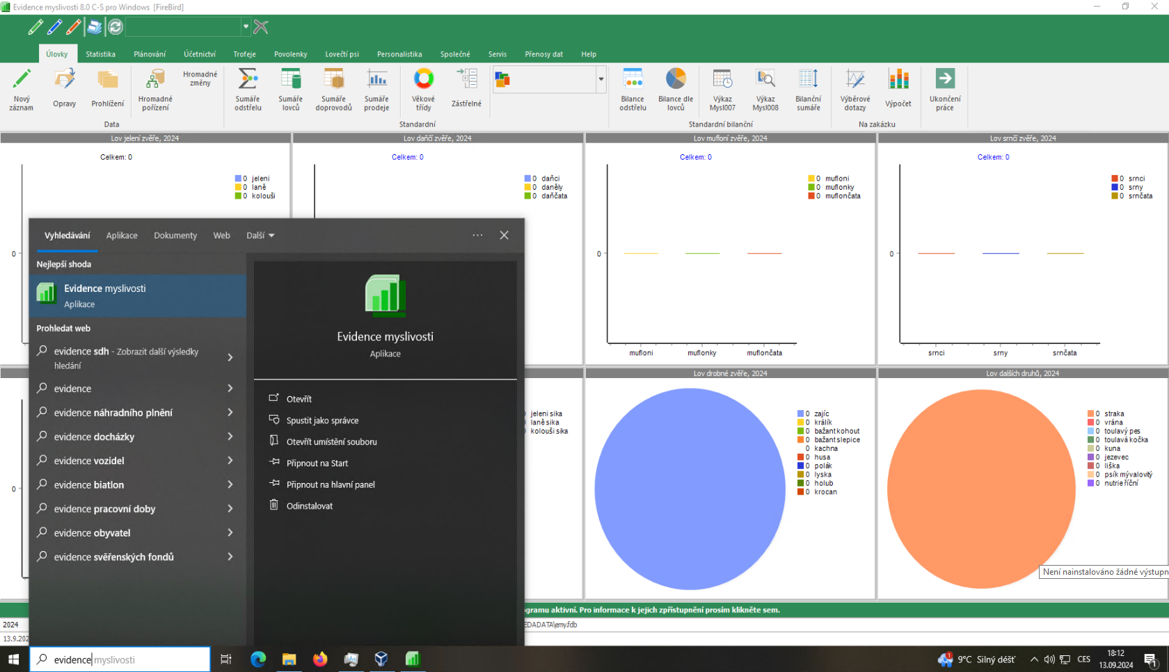 ukázka nabídky start s nalezeným softwarem Evidence Myslivosti od Yamaco software, v pozadí jde vidět nastartovaný program Evidence Myslivosti